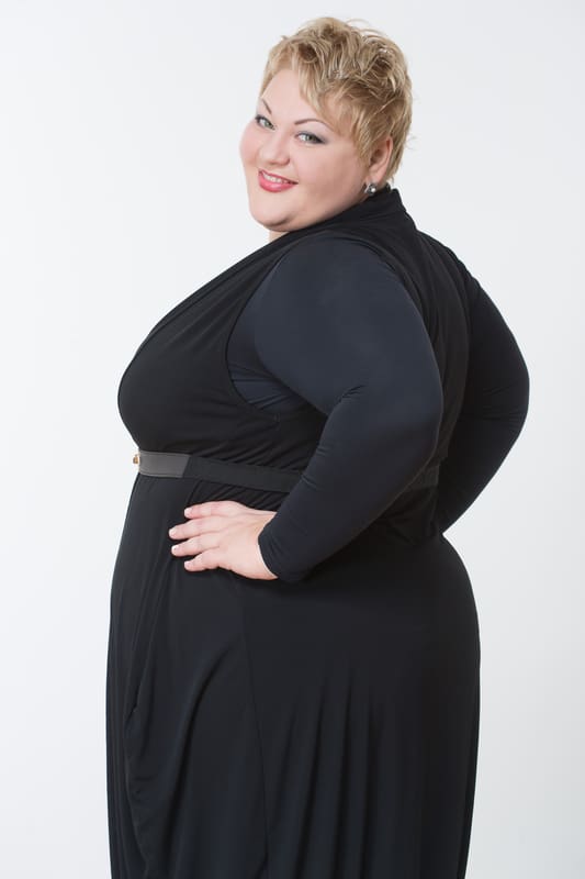 Plus size woman in black dress