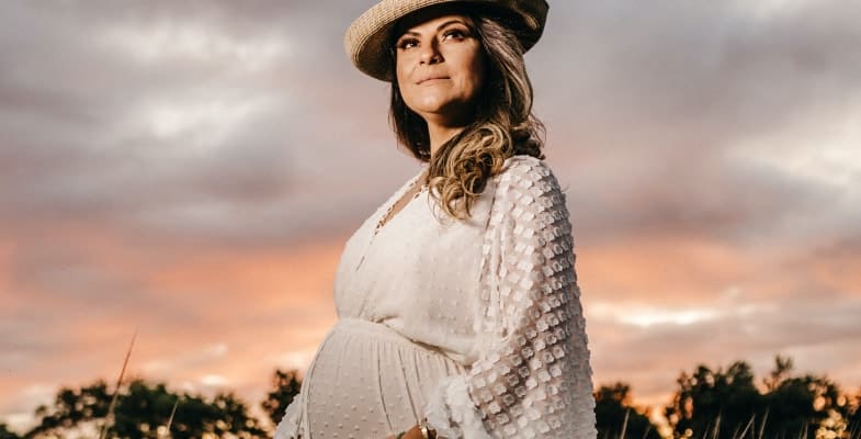 pregnant woman wearing a hat