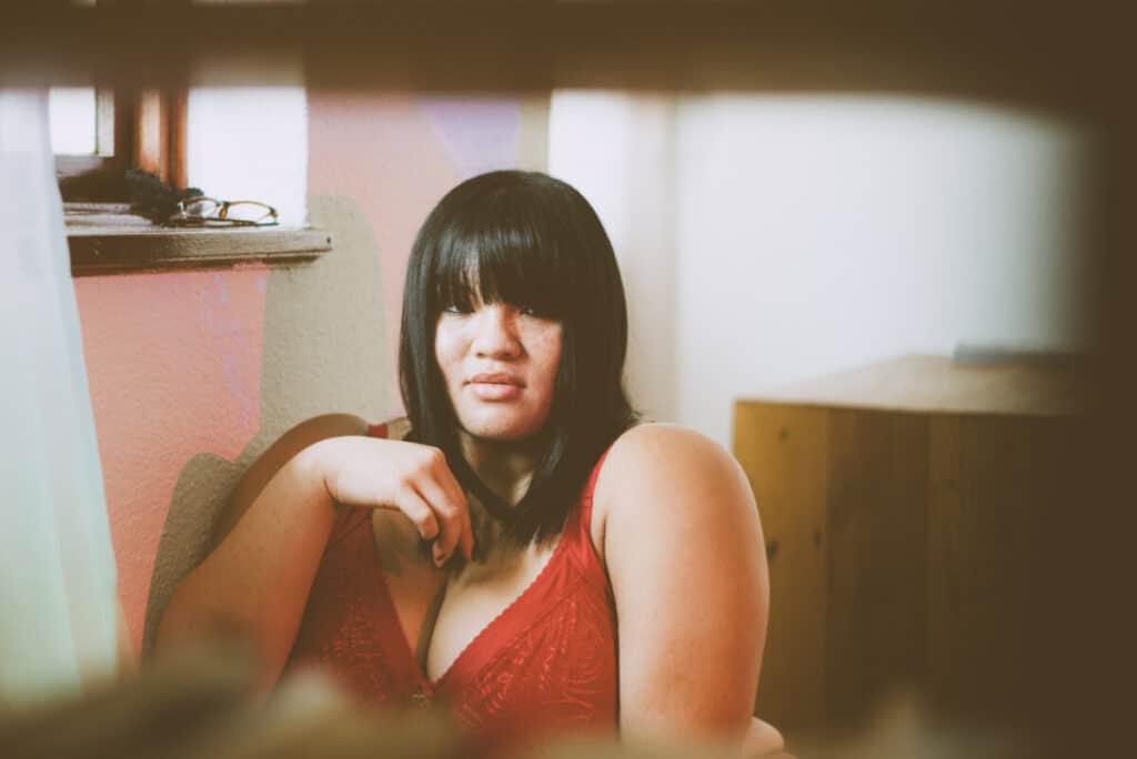 woman posing at home in red bra