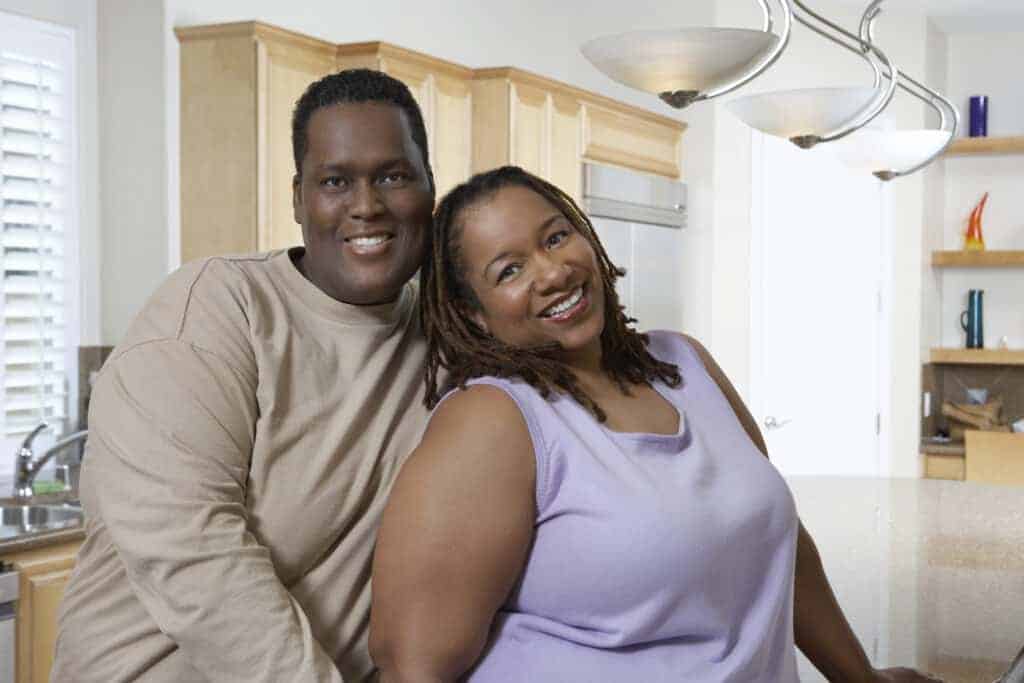 plus size couple in their home