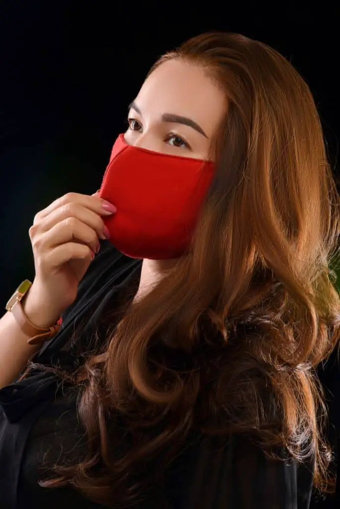 woman wearing a red face mask