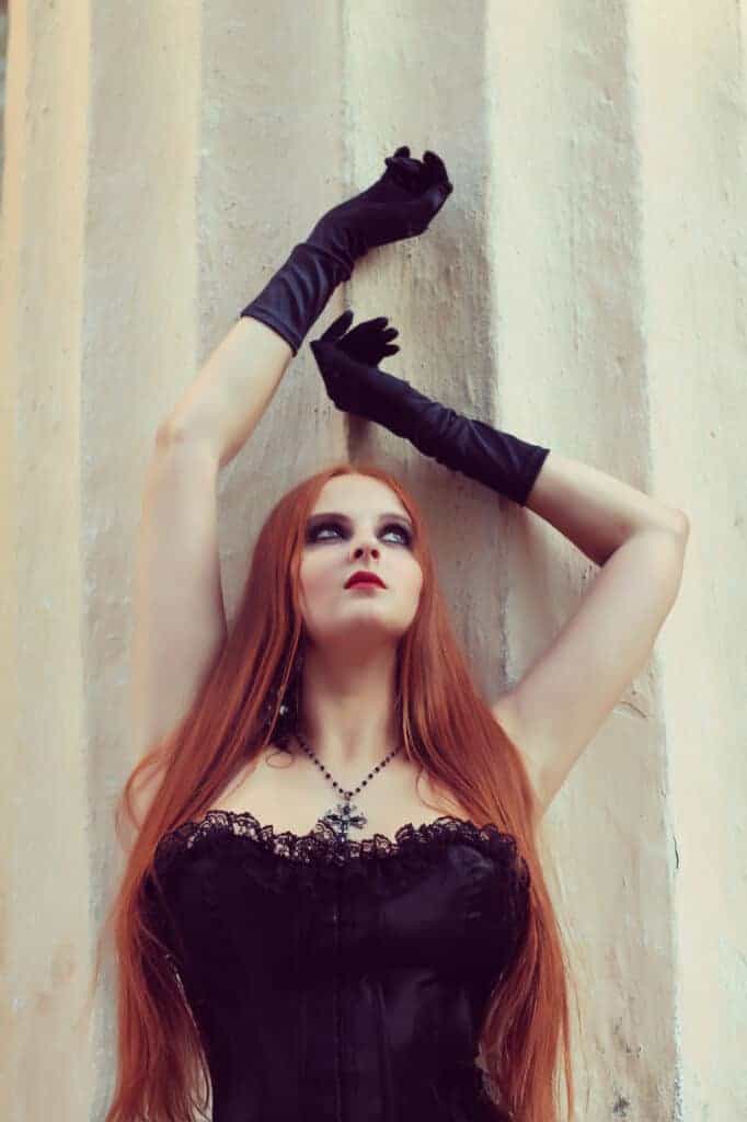 woman posing in plus size Goth clothing